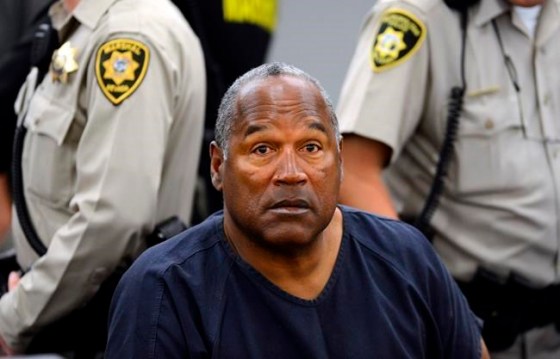 FILE - In this May 14, 2013 pool file photo, O.J. Simpson sits during a break on the second day of an evidentiary hearing in Clark County District Court in Las Vegas. Simpson, the former football star, TV pitchman and now Nevada prison inmate, will have a lot going for him when he appears before state parole board members Thursday, July 20, 2017 seeking his release after more than eight years for an ill-fated bid to retrieve sports memorabilia. (AP Photo/Ethan Miller, Pool, File)