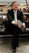Finance Minister Jim Flaherty tries on a pair of new shoes in advance of delivering his budget, in Ottawa, Wednesday, March 28, 2012. THE CANADIAN PRESS/Fred Chartrand