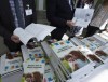 People sift through the 2019 budget booklet at a lockup session with experts and reporters in Ottawa on Tuesday, March 19, 2019. THE CANADIAN PRESS/Fred Chartrand