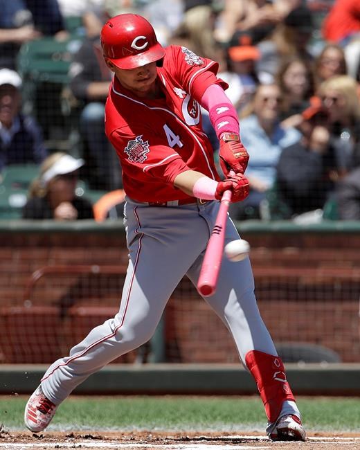Cincinnati Reds' Jose Iglesias hits a two-run single against the San Francisco Giants during the first inning of a baseball game in San Francisco, Sunday, May 12, 2019. (AP Photo/Jeff Chiu)