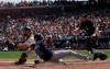 Tampa Bay Rays' Kevin Kiermaier, center, scores a run past San Francisco Giants catcher Erik Kratz, left, as umpire Tripp Gibson, right, watches during the fourth inning of a baseball game in San Francisco, Sunday, April 7, 2019. (AP Photo/Jeff Chiu)