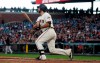 San Francisco Giants' Madison Bumgarner hits an RBI single against the Colorado Rockies during the fourth inning of a baseball game in San Francisco, Tuesday, June 25, 2019. (AP Photo/Jeff Chiu)