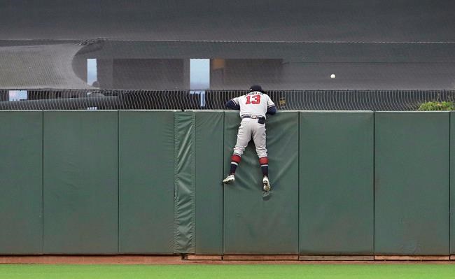 Atlanta Braves center fielder Ronald Acuna Jr. (13) watches as a home run by San Francisco Giants' Brandon Crawford lands in the outfield during the sixth inning of a baseball game in San Francisco, Monday, May 20, 2019. (AP Photo/Jeff Chiu)