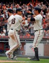 San Francisco Giants' Connor Joe (18) and Joe Panik, right, celebrate after scoring in the fifth inning of a baseball game against the Tampa Bay Rays, Saturday, April 6, 2019, in San Francisco. The pair scored after Giants' Steven Duggar doubled to right field. (AP Photo/Eric Risberg)