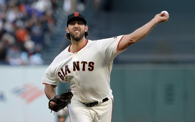 San Francisco Giants pitcher Madison Bumgarner throws to a Chicago Cubs batter during the fourth inning of a baseball game in San Francisco, Tuesday, July 23, 2019. (AP Photo/Jeff Chiu)