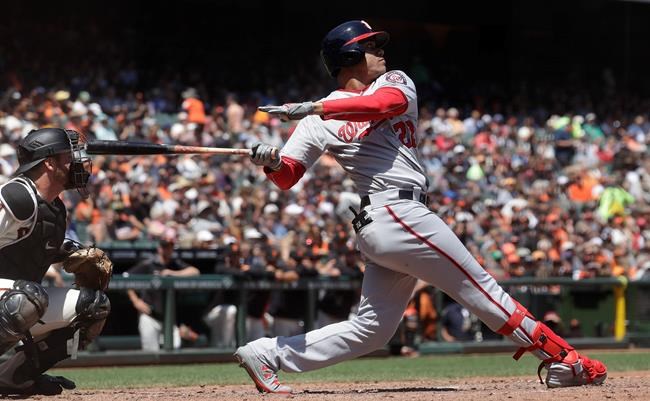 Washington Nationals' Juan Soto swings while flying out against the San Francisco Giants during the fourth inning of a baseball game in San Francisco, Wednesday, Aug. 7, 2019. (AP Photo/Jeff Chiu)