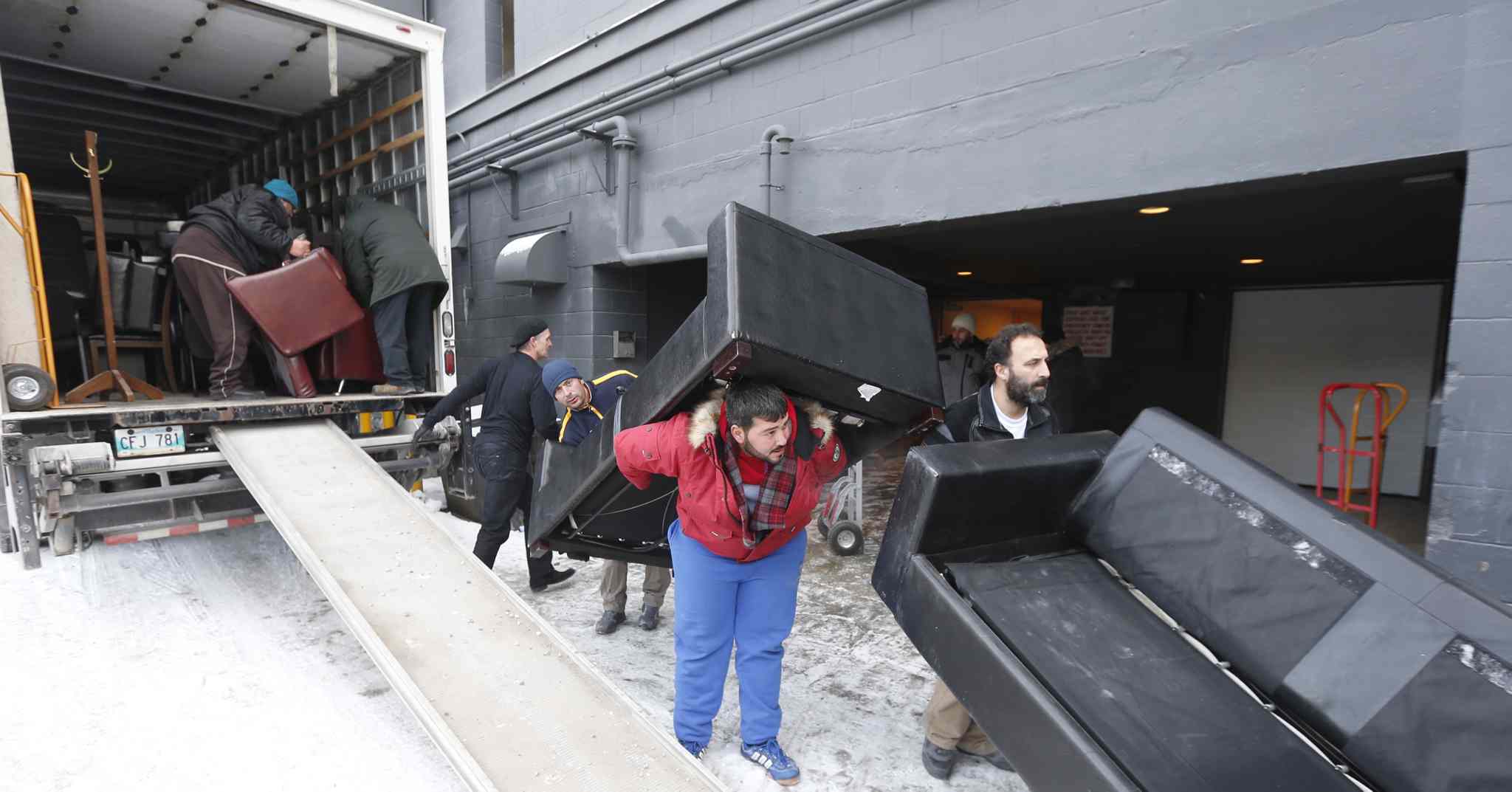 Volunteers move donated furniture to help Syrian refugees Winnipeg