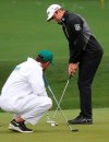 Corey Conners, winner of last week's Texas Open, works on his putting at the practice area for the Masters golf tournament at Augusta National Golf Club in Augusta, Ga., Tuesday, April 9, 2019. (Curtis Compton/Atlanta Journal-Constitution via AP)