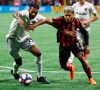 Atlanta United forward Josef Martinez, right, and D.C. United defender Donovan Pines, left, battle for the ball in front of the D.C. United goal during the first half in a soccer match on Sunday, July 21, 2019, in Atlanta. (Curtis Compton/Atlanta Journal-Constitution via AP)