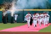 The Atlanta Braves take the field on a red carpet to play the Chicago Cubs in a baseball game, Monday, April 1, 2019, in Atlanta. (Curtis Compton/Atlanta Journal-Constitution via AP)