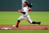 Atlanta Braves Ozzie Albies loses his helmet rounding second base while hitting a triple against the San Diego Padres during the first inning of a baseball game, Wednesday, May 1, 2019 in Atlanta. (Curtis Compton/Atlanta Journal-Constitution via AP)