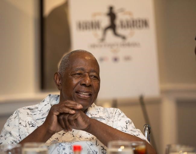 Hank Aaron answers questions from the crowd during the Hank Aaron Invitational at SunTrust Park in Atlanta, Aug. 2, 2019. (Steve Schaefer/Atlanta Journal-Constitution via AP)