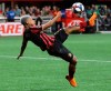 Atlanta United forward Josef Martinez attempts a bicycle shot on goal that he missed against New York City FC in their soccer match on Sunday, August 11, 2019, in Atlanta. Martinez went on to score both his team's goals in a 2-1 victory over NYCFC. (Curtis Compton/Atlanta Journal-Constitution via AP)