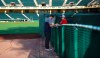 Atlanta Braves pitcher Patrick Weigel signs an autograph for Jeanette Marlier at the gate at baseball spring training in Kissimmee, Fla., Friday, Feb. 15, 2019. (Curtis Compton/Atlanta Journal-Constitution via AP)