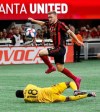 Atlanta United's Julian Gressel scores a goal against Philadelphia Union goalkeeper Andre Blake during the first half of an MLS soccer Eastern Conference semifinal Thursday, Oct. 24, 2019, in Atlanta. (Curtis Compton/Atlanta Journal-Constitution via AP)