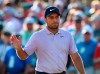 Francesco Molinari waves on the 18th green making a par to finish at 13 under for the lead in the Masters golf tournament at Augusta National on Saturday, April 13, 2019, in Augusta, Ga. (Curtis Compton/Atlanta Journal-Constitution via AP)