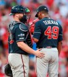 Atlanta Braves catcher Brian McCann, left, confers with pitcher Julio Teheran just before Teheran gave up a winning sacrifice fly to St. Louis Cardinals catcher Yadier Molina to score Kolten Wong during the 10th inning of Game 4 of a baseball National League Division Series, Monday, Oct. 7, 2019, in St. Louis. (Curtis Compton/Atlanta Journal-Constitution via AP)