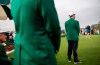 Marta Perez, of Spain, right, tees off the first hole as members of the Augusta National Golf Club, wearing the traditional green jackets, look on during the final round of the Augusta National Women's Amateur golf tournament in Augusta, Ga., Saturday, April 6, 2019. (AP Photo/David Goldman)