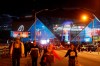 Pedestrians walk in front of Mercedes-Benz Stadium ahead of Sunday's NFL Super Bowl 53 football game between the Los Angeles Rams and New England Patriots in Atlanta, Saturday, Feb. 2, 2019. (AP Photo/David Goldman)