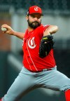 Cincinnati Reds' Tanner Roark pitches during the first inning of an exhibition baseball game against the Atlanta Braves, Monday, March 25, 2019, in Atlanta. (AP Photo/John Amis)