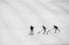 Atlanta Braves grounds crew roll water off a tarp covering the infield before a delay in the start of a baseball game against the New York Mets was announced Sunday, April 4, 2019, in Atlanta. (AP Photo/John Amis)