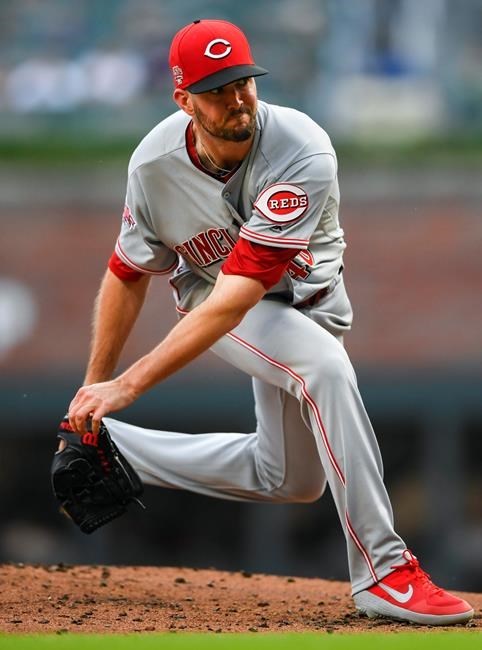 Cincinnati Reds' Alex Wood pitches against the Atlanta Braves during the first inning of a baseball game Friday, Aug. 2, 2019, in Atlanta. (AP Photo/John Amis)