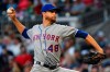 New York Mets' Jacob deGrom pitches against the Atlanta Braves during the first inning of a baseball game Sunday, April 14, 2019, in Atlanta. (AP Photo/John Amis)