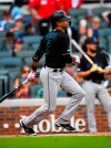 Miami Marlins' Yadiel Rivera watches his line drive to left field for a two-run single during the fifth inning of a baseball game against the Atlanta Braves, Saturday, July 6, 2019, in Atlanta. (AP Photo/John Amis)