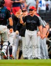 Miami Marlins manager Don Mattingly congratulates players as they come off the field after a baseball game against the Atlanta Braves, Saturday, July 6, 2019 in Atlanta. Miami won 5-4. (AP Photo/John Amis)