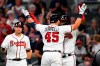 Atlanta Braves' Francisco Cervelli (45) celebrates his two-run home run at home plate with Adeiny Hechavarria during the fifth inning of a baseball game against the San Francisco Giants, Saturday, Sept. 21, 2019, in Atlanta.(AP Photo/John Amis)