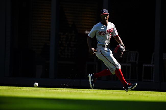 Washington Nationals right fielder Michael Taylor chases down a line drive to right field by Atlanta Braves' Johan Camargo during the ninth inning of a baseball game Sunday, Sept. 8, 2019, in Atlanta. AP Photo/John Amis)