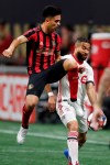 Atlanta United midfielder Gonzalo Martinez (10) and Toronto FC midfielder Jonathan Osorio (21) vie for control of the ball the first half of their MLS Eastern Conference final soccer match Wednesday, Oct. 30, 2019 in Atlanta. (AP Photo/John Bazemore)