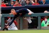 Atlanta Braves starting pitcher Mike Foltynewicz reaches over the dugout railing for a foul ball in the first inning of a baseball game against the New York Mets Tuesday, June 18, 2019, in Atlanta. Foltynewicz was not in the starting lineup. (AP Photo/John Bazemore)