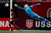 Atlanta United goalkeeper Brad Guzan (1) dives to block a shot during the first half of the U.S. Open Cup soccer match against the Minnesota United Tuesday, Aug. 27, 2019, in Atlanta. (AP Photo/John Bazemore)