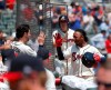 Atlanta Braves' Ozzie Albies, right, celebrates with Dansby Swanson (7) after hitting a solo-home run in the first inning of a baseball game against the Colorado Rockies Sunday, April 28, 2019, in Atlanta. (AP Photo/John Bazemore)