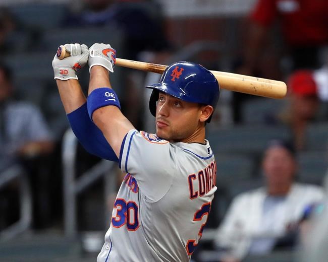 New York Mets' Michael Conforto drives in a run with a double in the third inning of a baseball game against the Atlanta Braves Tuesday, June 18, 2019, in Atlanta. (AP Photo/John Bazemore)