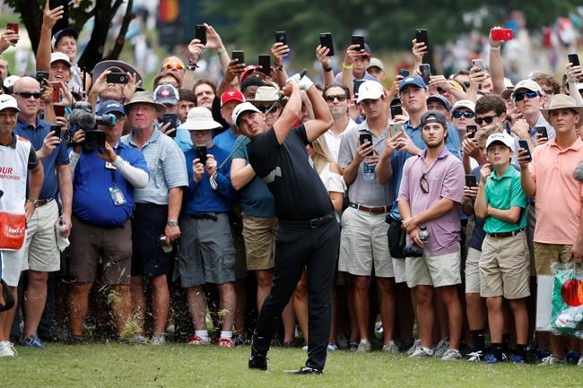 Brooks Koepka hits from off the first fairway during the final round of the Tour Championship golf tournament Sunday, Aug. 25, 2019, at East Lake Golf Club in Atlanta. (AP Photo/John Bazemore)