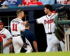 Atlanta Braves center fielder Ender Inciarte (11) holds his leg as he walks past Dansby Swanson on his way to the clubhouse after being injured in the third inning of a baseball game against the San Diego Padres, Monday, April 29, 2019, in Atlanta. (AP Photo/John Bazemore)
