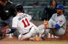 Atlanta Braves' Ender Inciarte (11) beats the tag from Chicago Cubs relief pitcher Carl Edwards Jr. (6) to score on a wild pitch in the fifth inning of baseball game Thursday, April 4, 2019, in Atlanta. (AP Photo/John Bazemore)