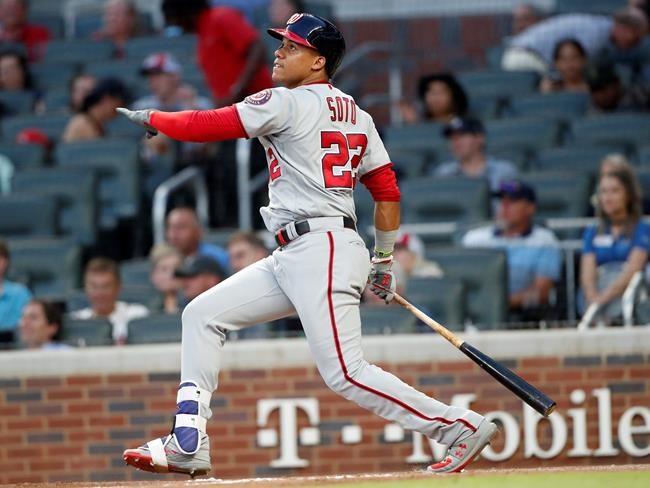 Washington Nationals' Juan Soto (22) follows through on a solo home run in the fourth inning of a baseball game against the Atlanta Braves Wednesday, May 29, 2019, in Atlanta. (AP Photo/John Bazemore)