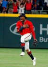Atlanta Braves center fielder Ronald Acuna Jr. reacts after defeating the San Francisco Giants 6-0 in a baseball game to clinch the NL east baseball title Friday, Sept. 20, 2019, in Atlanta. (AP Photo/John Bazemore)