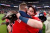 Atlanta Braves shortstop Dansby Swanson (7), right, embraces first baseman Freddie Freeman (5) after defeating the San Francisco Giants in a baseball game to clinch the NL East baseball title Friday, Sept. 20, 2019, in Atlanta. (AP Photo/John Bazemore)