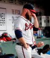 Atlanta Braves relief pitcher A.J. Minter (33) reacts in the dugout after blowing a save and being replaced in the ninth inning of a baseball game against the Colorado Rockies, Saturday, April 27, 2019, in Atlanta. Colorado won 9-5. (AP Photo/John Bazemore)