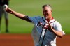 Former Atlanta Braves player and MLB Hall of Fame baseball player Chipper Jones throws the a ceremonial pitch ahead of Game 1 of a best-of-five National League Division Series between the Atlanta Braves and the St. Louis Cardinals, Thursday, Oct. 3, 2019, in Atlanta. (AP Photo/John Bazemore)