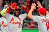 CORRECTS TO DOUBLE, INSTEAD OF SINGLE - St. Louis Cardinals' Marcell Ozuna (23) celebrates his two-run double against the Atlanta Braves in the ninth inning during Game 1 of a best-of-five National League Division Series, Thursday, Oct. 3, 2019, in Atlanta. (AP Photo/John Bazemore)