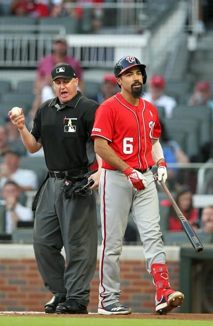 Washington Nationals batter Anthony Rendon (6) talks back to home plate umpire Ryan Blakney after being called out on strikes during the first inning of a baseball game against the Atlanta Braves, Saturday, Sept. 7, 2019, in Atlanta. (AP Photo/Tami Chappell)