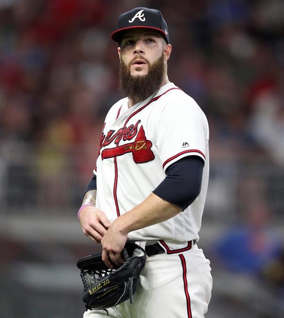 Atlanta Braves starting pitcher Dallas Keuchel reacts as he leaves the field during the sixth inning of a baseball game against the Kansas City Royals Tuesday, July 23, 2019, in Atlanta. (AP Photo/Tami Chappell)