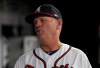 Atlanta Braves manager Brian Snitker talks to players in the dugout during the seventh inning of the team's baseball game against the New York Mets on Saturday, April 13, 2019, in Atlanta. (AP Photo/Tami Chappell)
