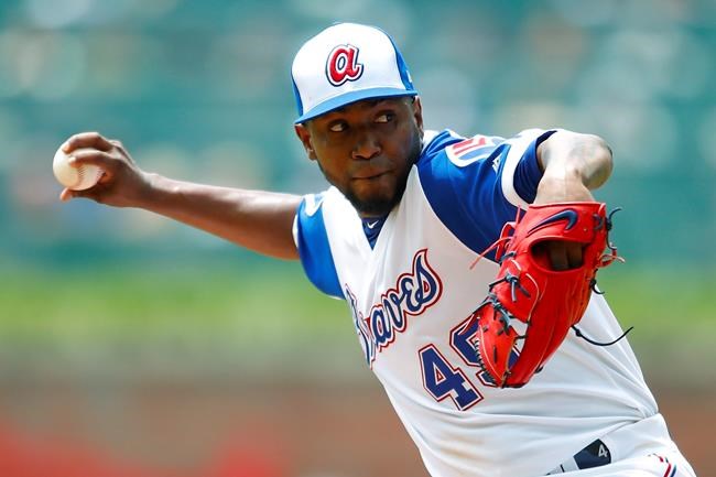 Atlanta Braves starting pitcher Julio Teheran delivers in the first inning of a baseball game against the Cincinnati Reds, Sunday, Aug.4, 2019, in Atlanta. (AP Photo/Todd Kirkland)