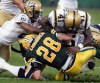 BRIAN J. GAVRILOFF / CANWEST NEWS SERVICE ARCHIVES
Jesse Lumsden was knocked out of Thursday’s game on this hit from Winnipeg Blue Bombers Siddeeq Shabazz and Fred Perry (41).
